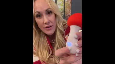 Woman explores pleasure with intimate toy