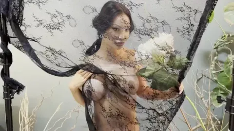 Naked with Flowers behind a Veil