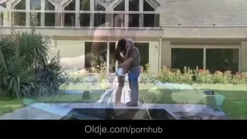 Mature man and young brunette in intimate encounter